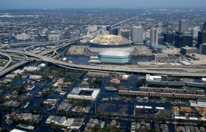 050831-N-8154G-115 New Orleans, La. (Aug 31, 2005) Ð Aerial view from a U.S. Navy helicopter assigned to Helicopter Sea Combat Squadron Two Eight (HSC-28), showing the rising flood waters threatening the entire downtown New Orleans city center, including the famed New Orleans Saints Super Dome. Tens of thousands of displaced citizens sought shelter at the dome, before, during and after Hurricane Katrina, but have been forced to evacuate as flood waters continue to rise throughout the area. HSC-28 flies the MH-60S Seahawk variant, based out of Norfolk, Va., and is embarked aboard the amphibious assault ship USS Bataan (LHD 5) participating in humanitarian assistance operations led by the Department of Defense, in conjunction with the Federal Emergency Management Agency (FEMA). Bataan has been tasked to be the Maritime Disaster Relief Coordinator for the NavyÕs role in the relief efforts. U.S. Navy photo by Photographer's Mate Airman Jeremy L. Grisham (RELEASED)